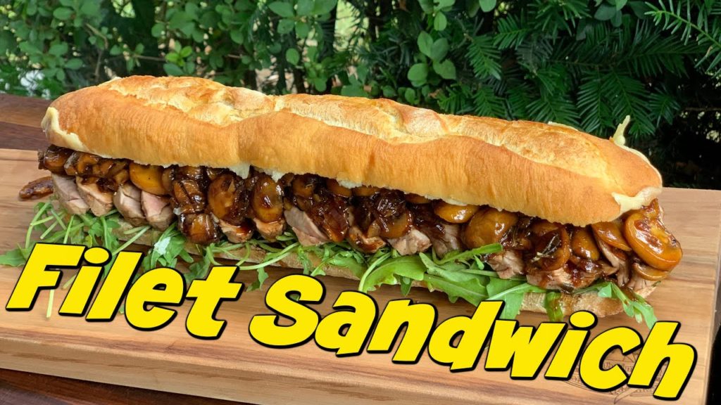 Sandwich mit Filet vom Kräuterschwein, Balsamico Champignons und Gruyere